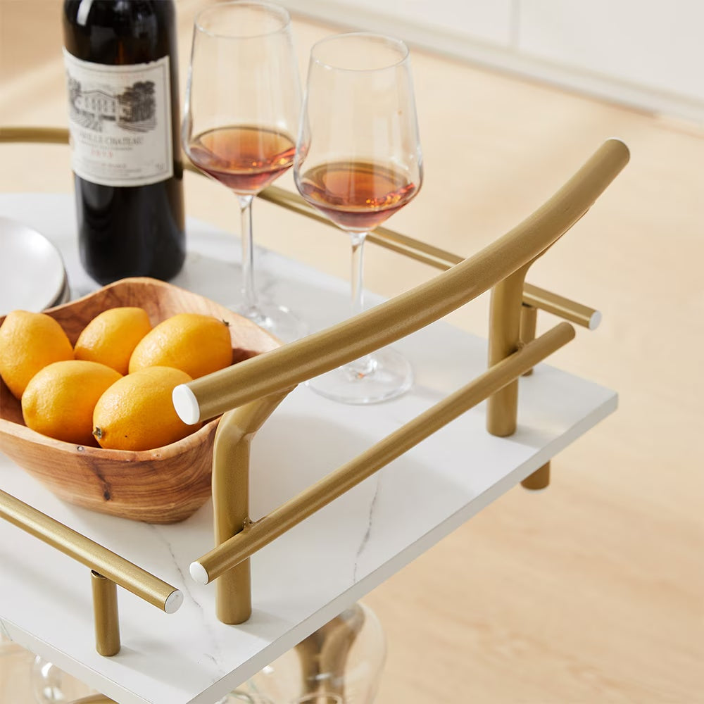 A Golden Wine Cart With Glass Shelves On The 2nd Floor Bar